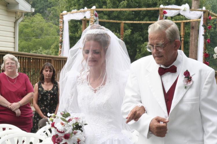 Daddy walking his oldest Debbie down the aisle